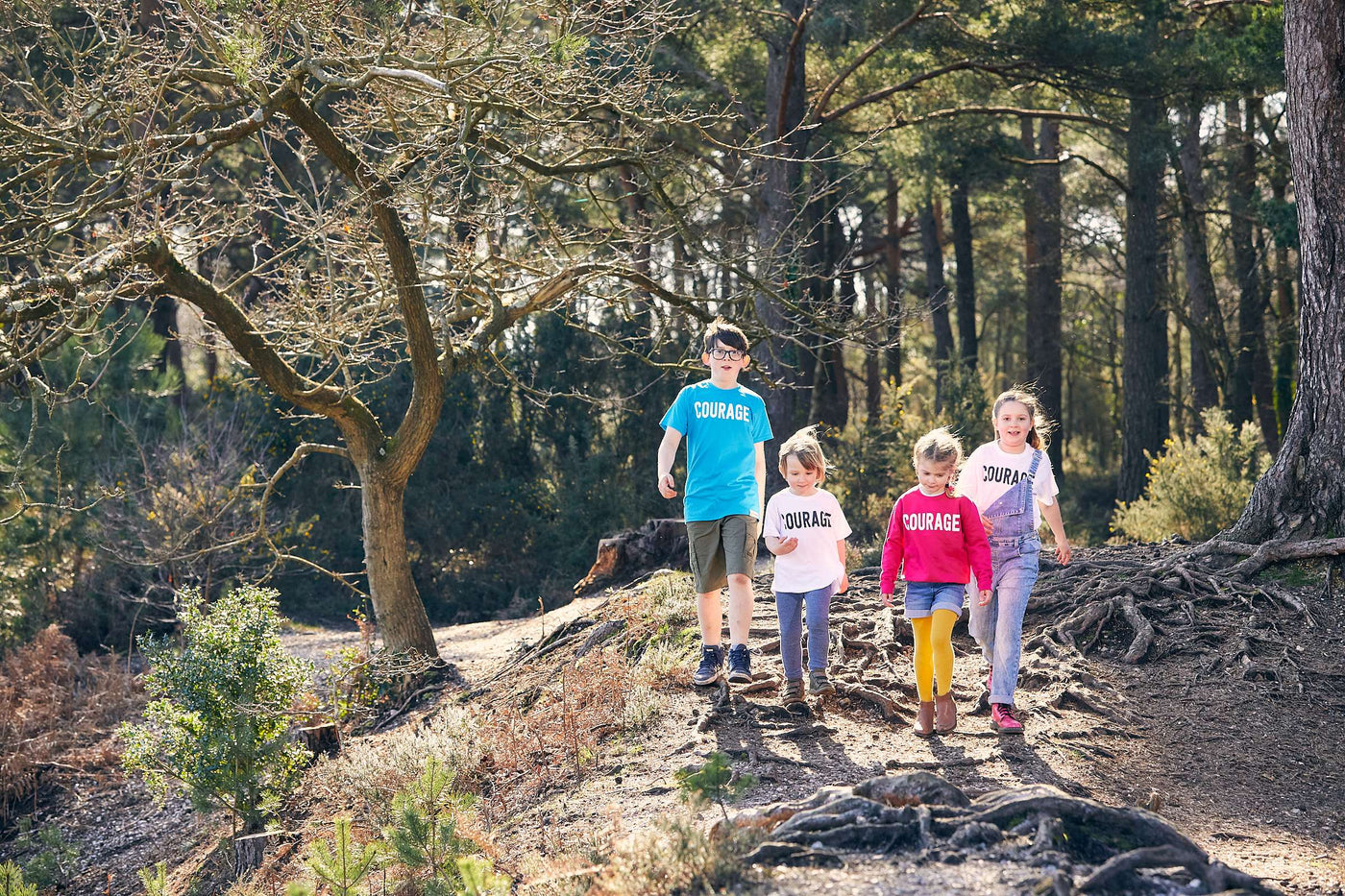 Picture of group of children walking through a forest